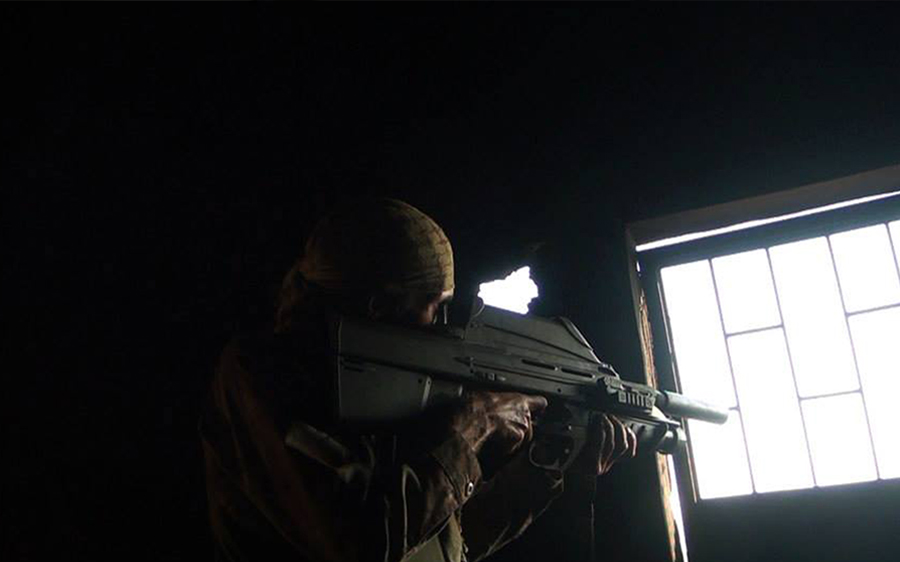 Matt VanDyke aims at sniper